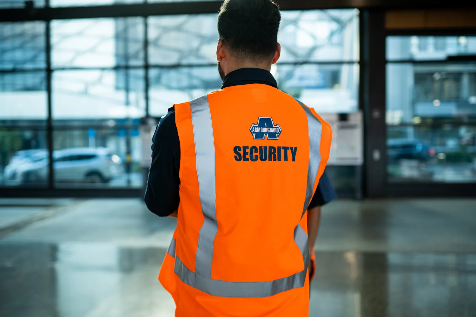 Security guard looking out window